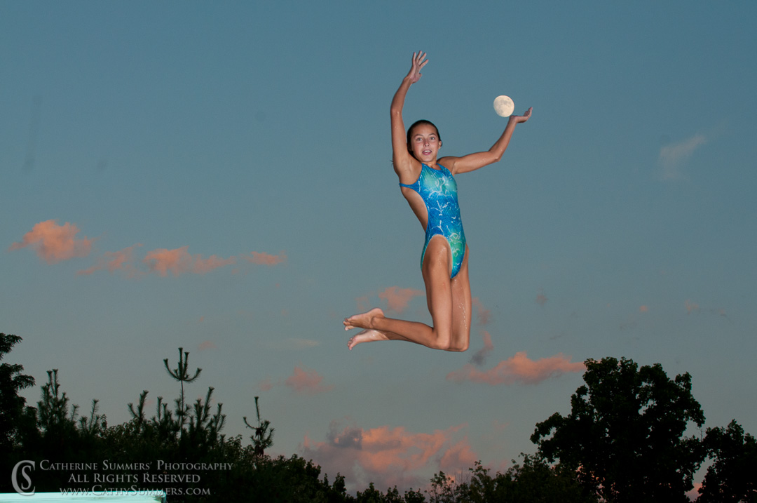 Swimmer Jump Serves the Moon on a Summer Evening at the Pool