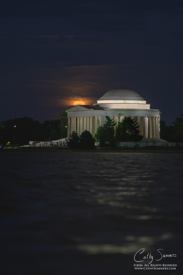 Flower Moon Rises through the Clouds behind the Jefferson Memorial